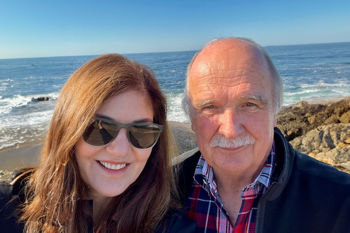 Karin and Bill standing in front of ocean