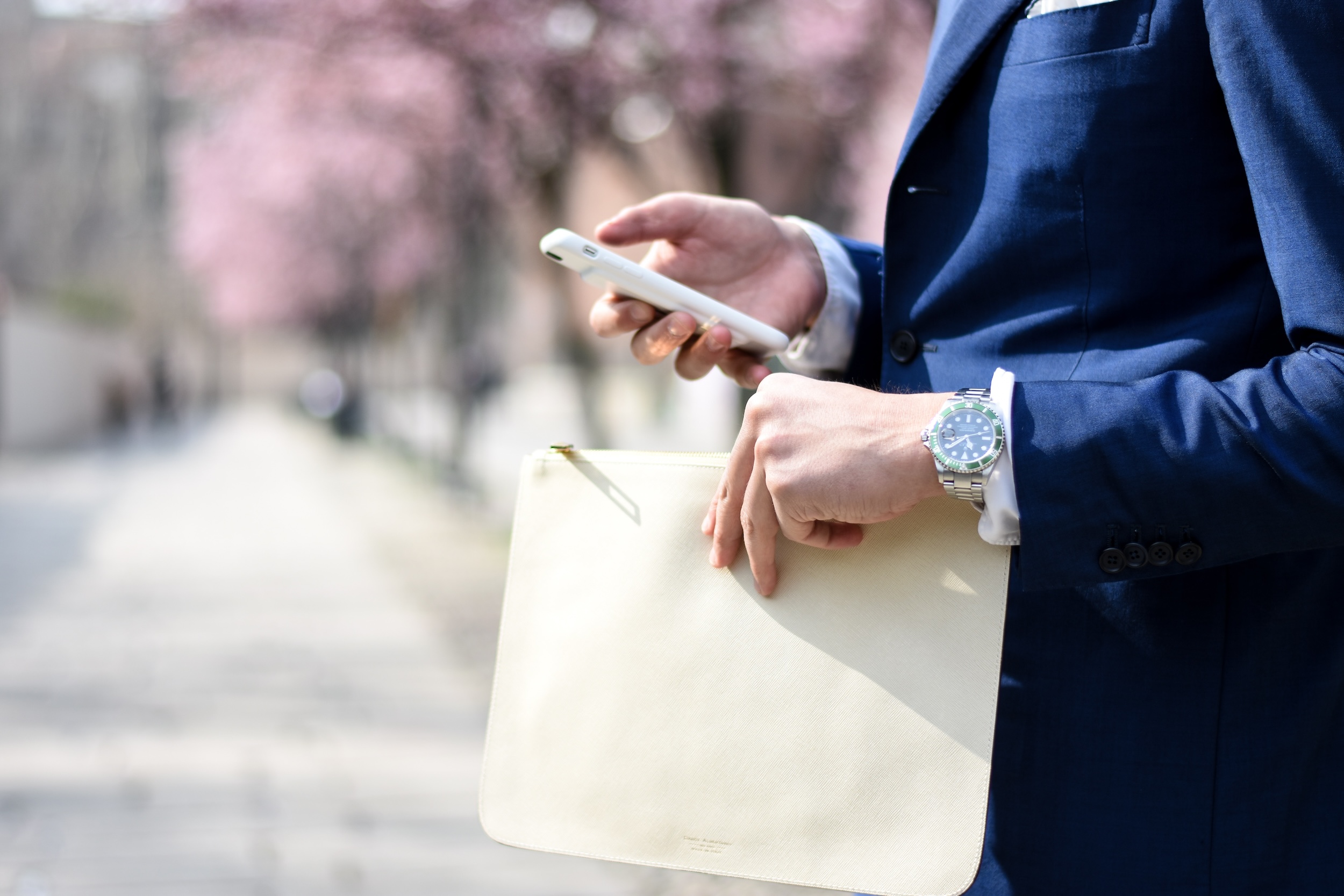 man holding mobile phone and envelope