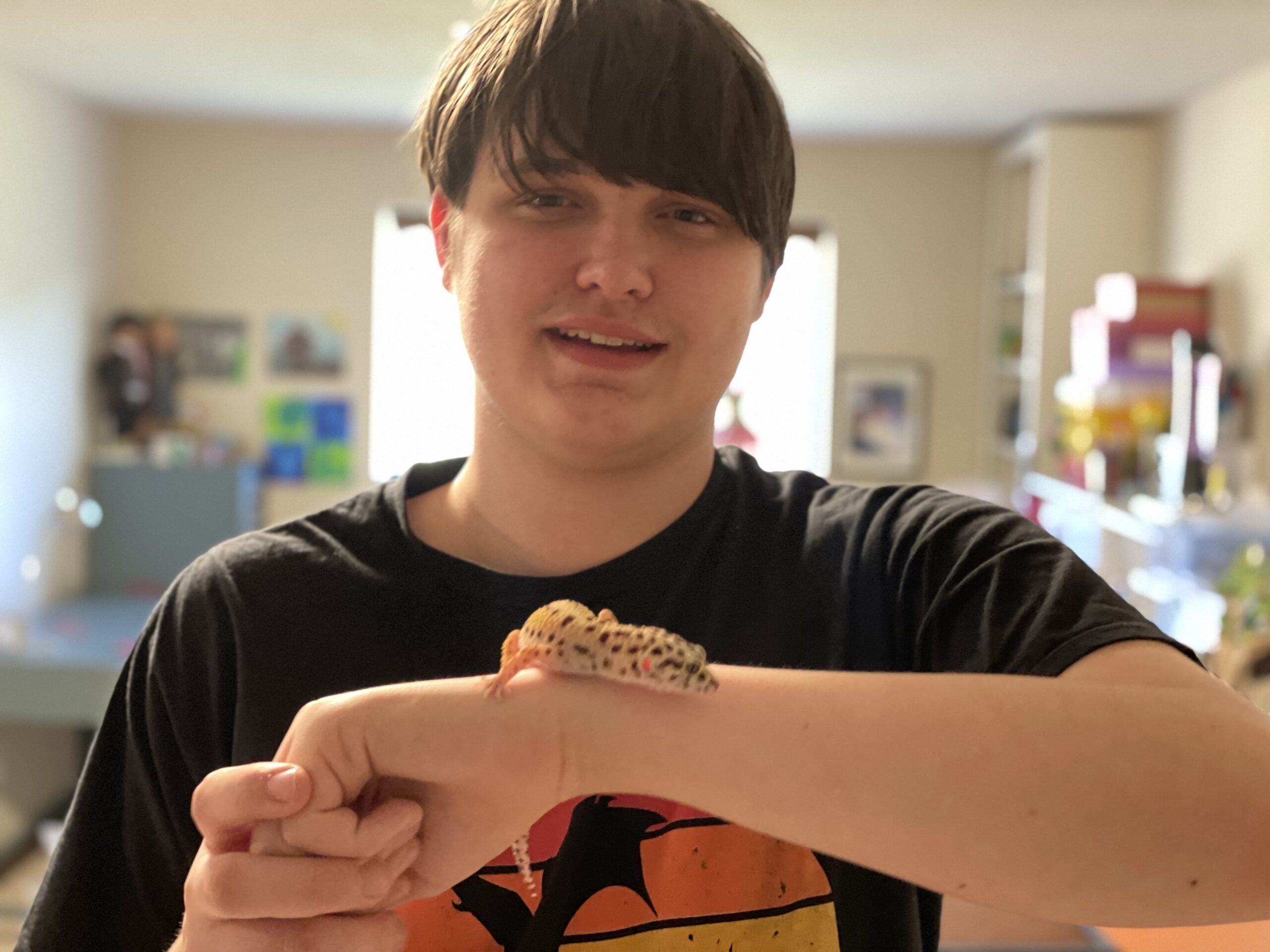 16 year old boy holding his gecko