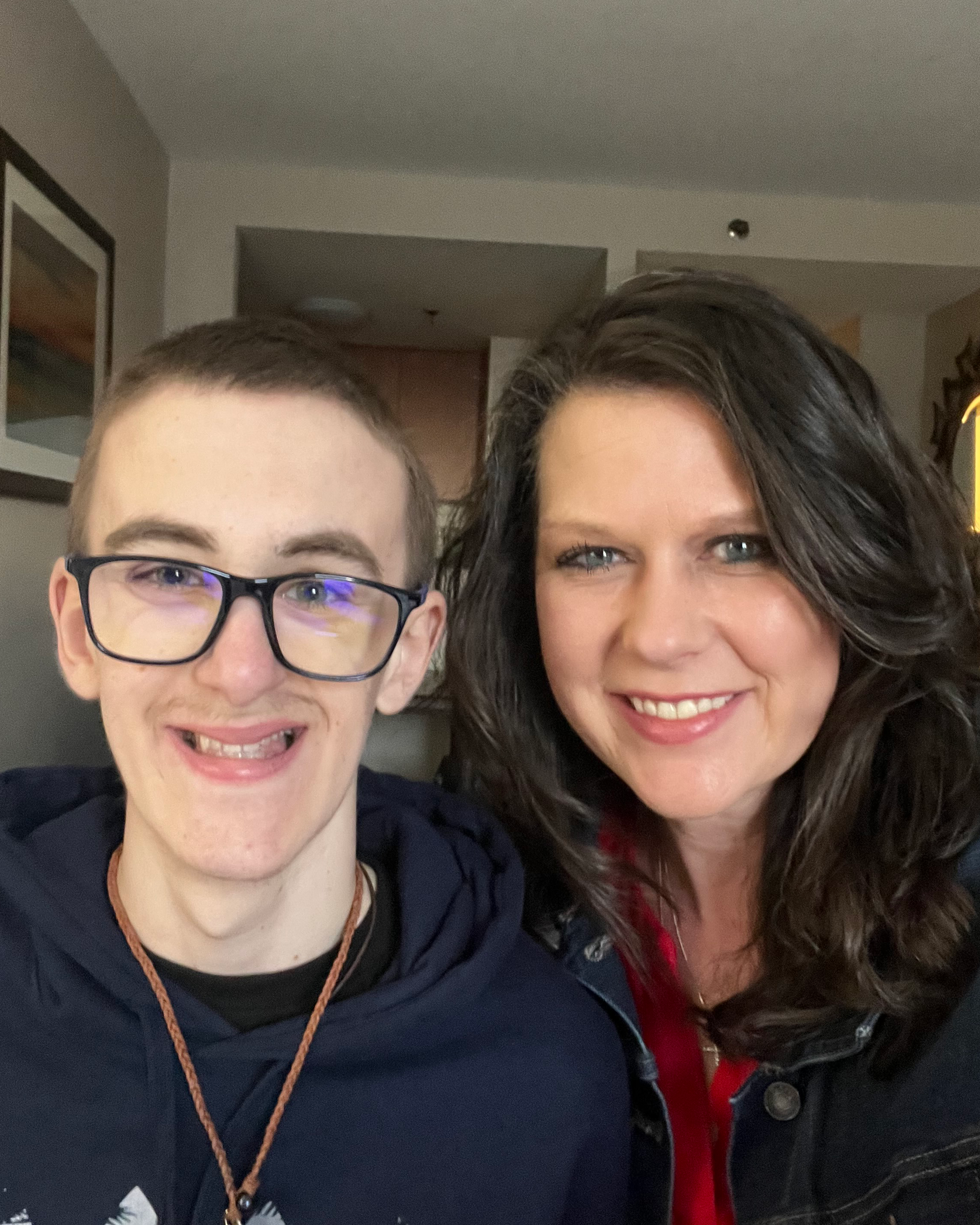 Ashle Burnett and Tripp smiling for a photo together.